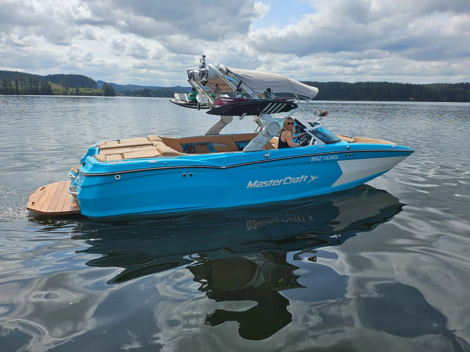 Side view of the blue MasterCraft XStar
