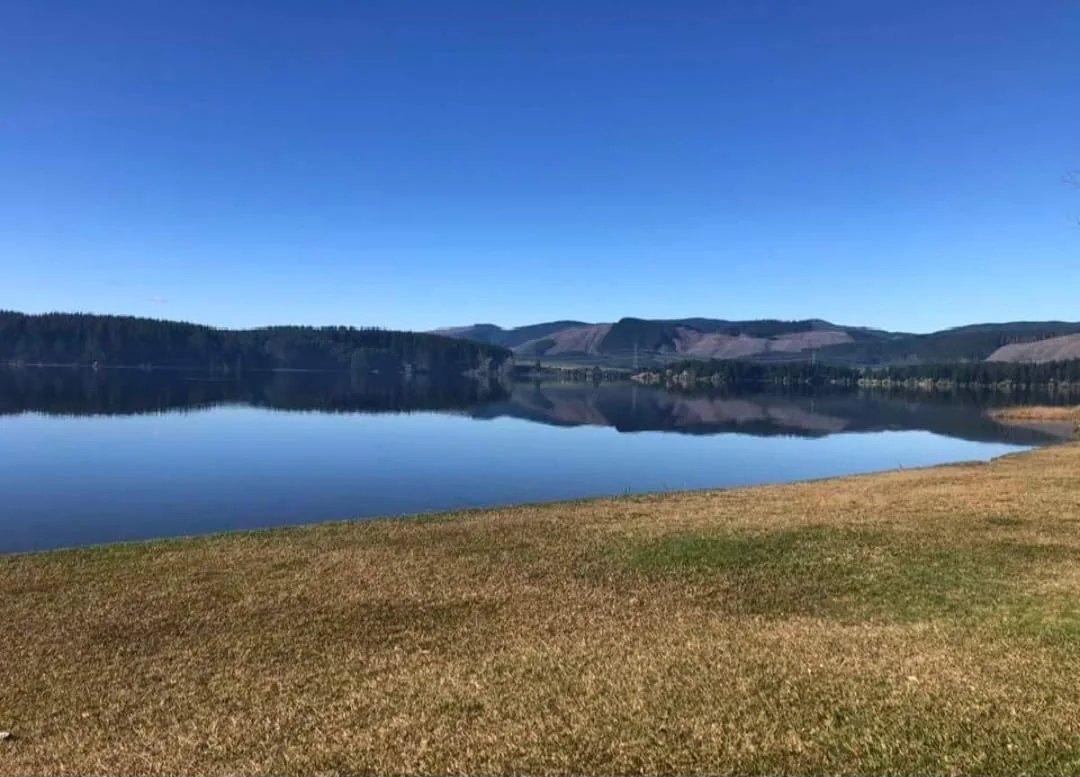 Calm Lake Maraetai and surrounding hills